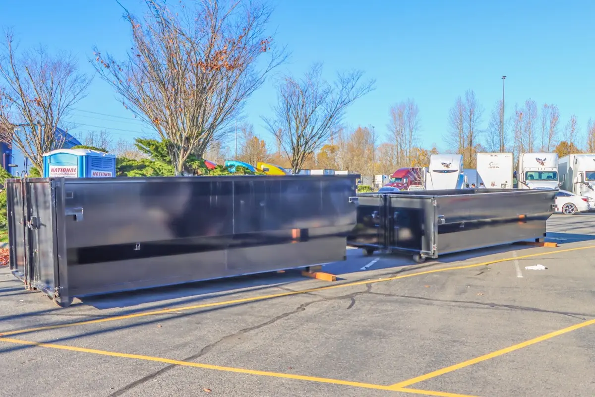 Professional dumpster rental service with roll-off container on residential driveway in Vernon Hills